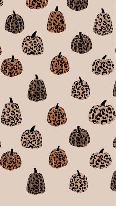 an animal print pumpkin pattern on a beige background