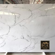 a large white marble slab in a warehouse