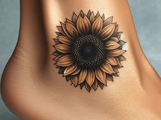 a sunflower tattoo is shown on the side of a woman's lower leg