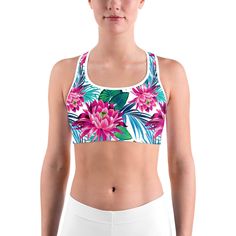 This gorgeous sports bra is made from moisture-wicking material that stays dry during low and medium intensity workouts. The bra has support material in the shoulder straps, double layer front, and a wide elastic band to ensure constant support. White Sports Bra, Black Sports Bra, Intense Workout, Tropical Flowers, Moisture Wicking Fabric, Scoop Neckline, Elastic Band, Shoulder Straps, Double Layer