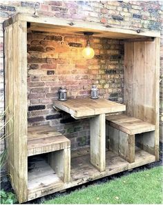 an outdoor bar made out of pallet wood with benches and stools on the side