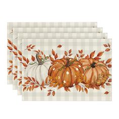 four placemats with pumpkins and leaves on the top one has a white checkered background