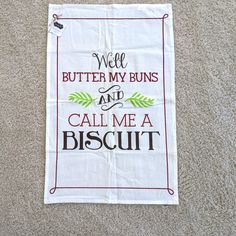 a kitchen towel that says well butter my buns and call me a biscuit