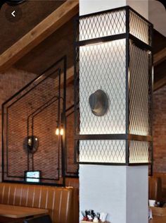 a tall white pillar sitting inside of a restaurant