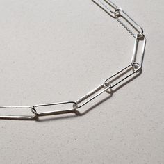 This is an image of a 20 sterling silver paperclip chain necklace by Jennifer Favour. This chain is long and lightweight and has a lobster clasp closure. Cable Chain Necklace, Fitness Bracelet, Ring Fit, Silver Chain Necklace, Minimalist Style, Paper Clip, Cable Chain, Ring Bracelet, Jewelry Care