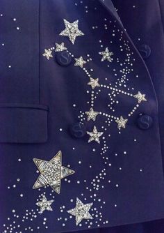 a man in a blue suit with stars on it