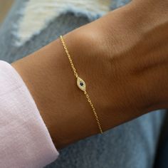 Dainty & minimalist evil eye bracelet is great for stacking or on it's own! Evil Eye is said to serve as protection and bring in only good energy! Great gift idea or as a friendship bracelet! Thick plating of 14k Gold or Rhodium plated over 925 Sterling Silver Two sizes available: 6.25" or 6.75" + .5" Extension 4mm Evil Eye Charm Lobster Clasp Closure Nickel-free and Hypoallergenic Highest Grade CZ stones for an authentic look Evil Eye Bracelet Silver, Rice Bead Bracelet, Bracelet Thick, Bracelet Tennis, Rice Bead, Protection Bracelet, Classy Jewelry, Eye Bracelet, Dainty Bracelets