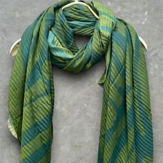 Introducing our beautifully handcrafted a geometric zebra pattern in green cotton blend scarf. Made from a special blend of 80% viscose,20% cotton. exceptional warmth without feeling too heavy.  Ideally for summer,autumn and winter seasons.  Perfect birthday gifts,anniversary and Christmas gifts.  SIZE : 180 cm X 100 cm.  MATERIEAL : 80 % Viscose  20 % Cotton  CARE : Hand wash in cold water.  Dry flat.  Do not tumbler dry !  GIFT : I would be happy to include a personal note for you if it's for Green Shawl For Beach, Casual Green Cotton Scarves, Green Casual Scarves One Size, Casual Green Scarves One Size, Casual Green Winter Shawl, Casual Green Scarf, Green Cotton Scarves For Spring, Spring Green Cotton Scarves, Green Bohemian Scarf One Size