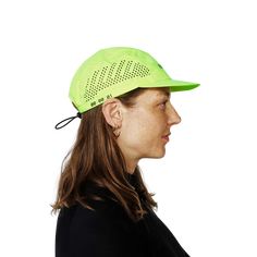 a woman wearing a neon green hat