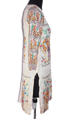 "Item Description Stunning pure silk off white colored hand embroidered kantha long Kurta Top. This dupatta is adorned with beautiful peacock design pink, yellow, green, brown thread work all over done. This stole from Bengal is hand embroidered with the traditional kantha running stitch in a beautiful floral pattern. Specialties :: KANTHA:Kantha is a hand embroidery style traditionally practiced by rural womenfolk in state of West Bengal. Kantha embroidery is recognized by running stitches. The Bohemian Off White Chanderi Kurta, Bohemian Off White Straight Kurta, White Silk Traditional Wear With Floral Embroidery, Bohemian Chanderi Embroidered Dress With Resham Embroidery, White Traditional Drape For Spring, Spring Silk Kurta With Multicolor Embroidery, Transitional White Salwar Kameez With Floral Embroidery, Bohemian Off White Kurta With Floral Embroidery, White Salwar Kameez With Floral Embroidery For Transitional Seasons