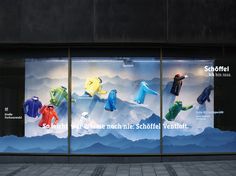 the window display is decorated with colorful clothing