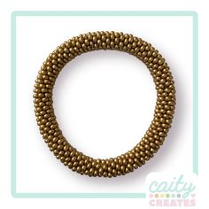 a gold beaded bracelet is shown on a white background with the words crafty creates