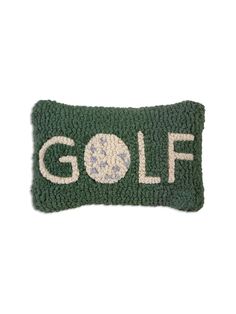 a green and white pillow with the word golf on it