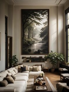 a living room filled with furniture and a painting on the wall