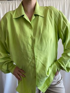 Lime green oversize shirt from 100 % silk . Labeled ad size D 44, F 46. Would fit from M oversize to XL . Chest 120 cm, length 68 cm, shoulders 45 cm . Perfect condition Trendy Fitted Button-up Shirt, Green Collared Shirt For Summer, Green Silk Button-up Blouse, Green Spread Collar Blouse For Summer, Oversized Tops With Spread Collar In Solid Color, Green Long Sleeve Tops For Spring, Oversized Green Shirt For Fall, Chic Long Sleeve Shirt For Spring, Trendy Solid Button-up Tops