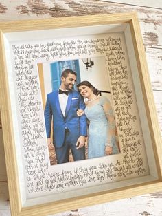 a wooden frame with an image of a man and woman in formal wear on it