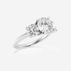 three stone diamond ring on a white background