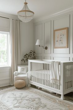 a baby's room with a white crib, chair and rug in it