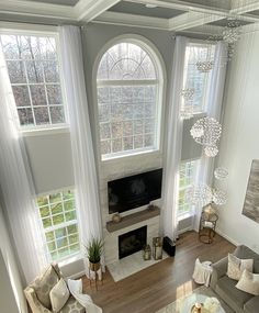 an overhead view of a living room with couches and windows