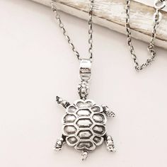 By Bhavya Jain in India, this turtle friend will be a welcome addition to your wardrobe. The delightful pendant is crafted from sterling silver, its shell treated with a combination of finishes that catches the eye. Circling the neck with cable chain, this accessory is perfect for all animal lovers. Silver Turtle Necklace For Gift, Silver Turtle Jewelry For Gifts, Silver Turtle Jewelry Gift, Sterling Silver Turtle Necklace For Gifts, Silver Turtle Jewelry, Sterling Silver Turtle Necklace For Gift, Silver Sterling Silver Turtle Jewelry, Elegant Silver Turtle Jewelry, Nickel-free Silver Turtle Jewelry