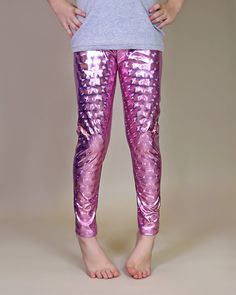 "Glitzy, shimmery, metallic pants, while lightweight fabric little ones comfy. These glam metallic pants are fun, and fashionable and your little lady will love wearing them with their perfect amount of pizazz and shine.  100% polyester  We recommend hand washing and hang drying this article of clothing to keep the metallic shine from fading * 3 year - 21\" waist / 23 1/2\" length * 4 year - 21 1/2\" waist / 25\" length * 5 year - 22 1/2\" waist / 26 1/2\" length * 6 year - 24\" waist / 27 1/2\" length * 7 year - 26 1/2\" waist / 27 1/2\" length * 8 year - 28\" waist / 30\" length * 10 year - 29 1/2\" waist / 32 1/2\" length * 12 year - 30 1/2\" waist / 34\" length * 14 year - 32\" waist / 35\" length" Shiny Metallic Leggings For Party, Metallic Shiny Leggings For Party, Pink Stretch Leggings For Party, Shiny Fitted Leggings For Parties, Party Full-length Leggings, Metallic Shiny Stretch Pants, Shiny Stretch Bottoms For Party Season, Metallic Fitted Leggings For Party, Iridescent Disco Bottoms For Party