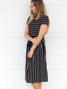 Looking for a dress that's both stylish and comfortable? Look no further than our Striped Midi Dress! With its classic stripes and midi-length, this dress is perfect for any occasion. Whether you're running errands or going out for a night on the town, this dress has got you covered. Pair it with a jean jacket and sneakers for a casual look, or dress it up with some great jewelry and heels for a more formal affair. Size: Small 0-4 Medium 6-8 Large 10-12 XL 12-14 Black Summer Dress With Striped Hem, Striped Casual Maxi Dress For Day Out, Striped Maxi Dress For A Casual Day Out, Casual Striped Maxi Dress For Day Out, Casual Striped Maxi Dress For Spring, Black Casual Dress With Striped Hem, Casual Black Dress With Striped Hem, Casual Striped Dresses For Day Out, Black Short Sleeve Dresses With Vertical Stripes