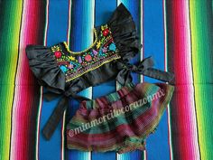 Taco twosday themed outfit, black mexican skirted bloomers, floral embroidered mexican blouse, fiesta san antonio, cinco de mayo dress, coco This is a super cute Mexican outfit with a twist, the hand embroidered crop top it is beautiful, the ruffled sleeve, completely open on the sides and the tie bows, definitely gives the perfect touch to our original design. The outfit every girl will dream about Outfit includes: Floral embroidered crop top and skirted bloomers. Fits 2T All our outfits are made with love and fits true to size. Care instructions: Wash by hand with cold water and hang to dry. * Visit the shop * https://www.etsy.com/shop/Miamorcitocorazon * Follow us on instagram * @miamorcitocorazonmx ------------------------------------------------------ I don't accept returns, exchanges Black Dresses For Cinco De Mayo Fiesta, Traditional Black Dress For Cinco De Mayo, Mayo Dress, Jalisco Dress, Mexican Skirts, Taco Twosday, Mexican Blouse, Mexican Outfit, Embroidered Crop Tops