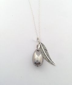 "Feathers appear when Angels are near <3 Due to the very sensitive nature of this purchase, I will do everything I can to make the process simple and seamless. Please note that your piece will be made with much love and light ♥ DETAILS ♥ * Your beautiful keepsake will be made with a combination of Sterling Silver and Stainless Steel * The teardrop urn pendant is stainless steel egg shape, it is not flat on one side and measures approximately 5/8\" long and 3/8\" at the widest point * The eleg Teardrop Locket Necklace For Keepsake, Teardrop Locket Necklace Keepsake, Spiritual Silver Teardrop Charm Necklace, Handmade Silver Charm Necklace For Keepsake, Silver Handmade Charm Necklace For Keepsake, Silver Charm Necklaces For Memorial, Sterling Silver Teardrop Necklace For Memorial, Sterling Silver Teardrop Necklaces For Memorial, Silver Teardrop Locket Necklace