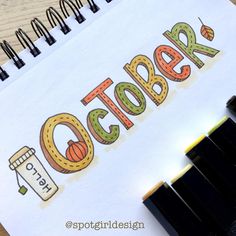 a notebook with the word october written on it