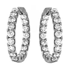 An elegant pair of inside/out style diamond hoop earrings featuring top quality brilliant diamonds prong-set in 18k White Gold. Total diamond weight 4.50 carats! Diamonds are F-G color and SI2 clarity. Stunning in every way, these earrings give just the right of sparkle to your look, whether for everyday casual wear, a night out, or a special date. ---Details--- * Natural Round Diamonds * Color: F-G * Clarity: SI2 * Weight: 4.50 carats total weight Metal: 18k White Gold Every treasure comes with Luxury Everyday Hoop Earrings With Prong Setting, Inside Out Style, White Gold Set, Gold Anniversary, Gift Ideas For Her, Italian Jewelry, Yellow Earrings, Diamond Hoop Earrings, Fine Jewels