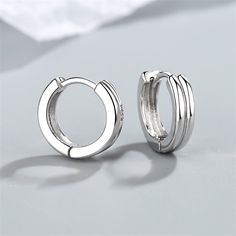 Finish your ensembles with these layered huggie earrings showcasing shiny silver-plated frames. 0.63" diameter Silver-plated copper Silver Jewellery Earrings, Line Earrings, Huggie Earrings Gold, Womens Jewellery, Costume Jewelry Earrings, Earrings Hoop, 925 Silver Earrings, Huggie Earrings, 925 Silver Jewelry