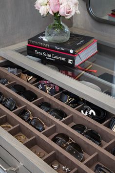 the drawers are filled with glasses and jewelry