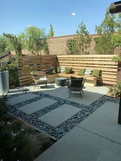 an outdoor patio with seating and landscaping