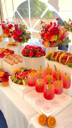 a table topped with lots of food and drinks