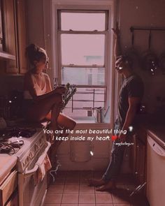 a man and woman standing in a kitchen next to each other with the words you are the most beautiful thing i keep inside my heart