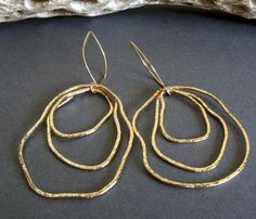 "Artisan handmade organic shape earrings. Each component is hand shaped so each will have it's own unique shape. The Details ∞ Artisan handmade jewelry ∞ 14k gold filled handmade textured drops ∞ 14k gold filled handmade ear hooks ∞ Approximate total length ~ 3\" ∞ Made to order Θ Allow up to 14 business days before shipment Θ ∞ Gift box included ∞ Made in the USA Pick up a matching pendant necklace here... https://www.etsy.com/listing/641990023/gold-boho-statement-necklace-large VISIT OUR SHOP: Artisan Freeform Gold Jewelry, Gold Freeform Earrings As Gift, Gold Freeform Earrings For Gift, Hand Forged Freeform Elegant Jewelry, Hammered Freeform Jewelry For Gifts, Hammered Freeform Jewelry As A Gift, Modern Freeform Gold Jewelry, Elegant Handmade Freeform Earrings, Texture Jewelry