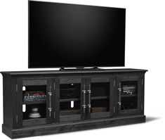 an entertainment center with a flat screen tv on top