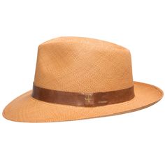 A man of mystery and undeniable style. Designed to help you keep your cool in any situation, with a padded comfort sweatband of exceptional breathability. Made of straw and is the color of toasted wheat, finely handwoven in Ecuador, and completed in the USA with a deep mocha leather hatband. Summer discoveries are waiting. Grab your hat, and get started. Material: 100% Toquilla StrawBrim: 2 3/8"Crown: 4 1/2" teardropClimate: Sun Handwoven in Ecuador. Hand-finished in the US. Measurements are app Classic Straw Hat With Adjustable Fit For Outdoor, Classic Outdoor Straw Hat With Adjustable Fit, Fitted Brown Casual Straw Hat, Fitted Brown Straw Hat Casual, Classic Adjustable Straw Hat For Outdoor, Fitted Casual Brown Straw Hat, Classic Brown Straw Hat For Summer, Classic Woven Panama Hat For Travel, Classic Natural Hat Bands For Outdoor