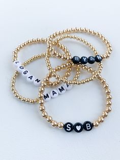 "PLEASE READ FULL DESCRIPTION BEFORE PLACING AN ORDER! This listing is for one personalized beaded name bracelet! These are perfect for stacking or even just to wear as one! They make great gifts for Valentine's Day, Mother's Day, bridal showers, baby showers and hospital gift for the new moms. ITEM DETAILS: *BEADS ARE GOLD FILLED - meaning they should last a long time with no tarnish or discoloration. *Choose from white (main color is white and letter is black) or black (main color is black and Adjustable Everyday Jewelry With Custom Text, Adjustable Custom Text Jewelry For Everyday Wear, Custom Name Beaded Bracelets For Personalized Gift, Customized Name Bracelet With Round Beads For Everyday, Customizable Name Bracelet With Round Beads For Personalized Gift, Customizable Name Bracelet With Round Beads As Personalized Gift, Customizable Beaded Bracelets For Birthday, Personalized Beaded Bracelet Jewelry, Everyday Customized Name Bracelet With Round Beads