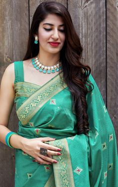 This Saree is Ready to Wear (With Fall and Pico Done). A designer saree in Sea Green Color. It has intricate design all over the saree. This saree is a suitable amalgamation of style and grace that is required from an ethnic wear. The saree is ideal for any formal gathering. The saree comes with an unstitched blouse of corresponding color and design as shown in the picture. Banarasi Silk Designer Sea Green Color Saree Fabric Type: Soft Banarasi SilkPrimary Colour: Sea GreenSecondary Colour(s): G Designer Paithani Silk Pre-draped Saree For Festivals, Pre-draped Meenakari Saree For Puja, Embroidered Paithani Silk Saree, Anarkali Style Meenakari Pre-draped Saree, Unstitched Saree With Meenakari, Paithani Silk Pre-draped Saree With Meenakari, Navratri Meenakari Pre-draped Saree For Puja, Navratri Puja Pre-draped Saree With Meenakari, Pre-draped Meenakari Saree For Puja And Navratri