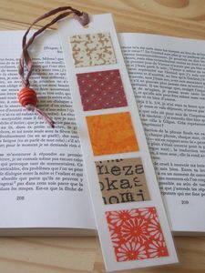 the bookmark is made out of paper and has different designs on it's side