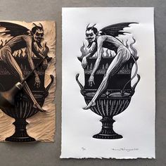 two paper cut art pieces on top of a table next to each other, one with a drawing of a demon and the other with a knife