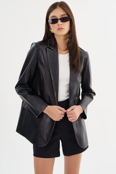 A timeless classic reimagined for the modern woman, the KARRIN Distressed Leather Blazer lends a relaxed yet refined silhouette, perfect for layering over your favorite tops and dresses. Designed with functionality in mind, it features sleek peaked lapels and chic flap pockets to keep essentials handy on the go. Drape it over your shoulders for a polished daytime look or wear it over a sleek dress for the evening. Sleek Dress, Leather Blazer, And Dresses, Distressed Leather, Timeless Classic, Modern Woman, Fall Fashion, The Modern, The Go