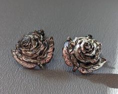 "Vintage Sterling Silver Rose Earrings Fine Sterling Silver earrings done in a textured rose design dating from the 1940s possibly earlier. Earrings are screw backs and nicely detailed. Earrings are fully hallmarked and will arrive gift boxed. * HALLMARKS Sterling on back of screws. * MEASUREMENTS  3/4\" x 3/4\" * WEIGHT 4.73 * CONDITION In very good to excellent condition. Please use pictures as part of item's description. * MATERIALS Sterling Silver." Formal Rose Earrings With Rose Design, Formal Rose-design Rose Earrings, Rose Design Flower Earrings For Formal Occasions, Formal Rose Design Earrings, Silver Vintage Flower Earrings For Formal Occasions, Formal Silver Earrings With Rose Design, Silver Rose Design Earrings For Formal Occasions, Silver Earrings With Rose Design For Formal Events, Rose Texture