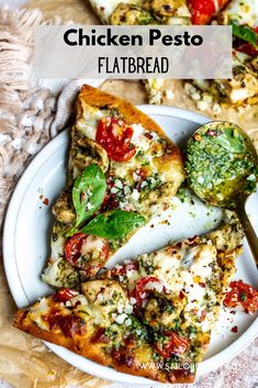 chicken pesto flatbread on a white plate with a green pepper and tomato garnish