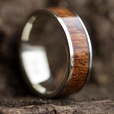 a wedding ring with a wooden inlay