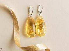 "SUBSCRIBE and get 10% OFF! http://eepurl.com/glhv05 After you have subscribed, please contact us at amber@torvela.com for the discount code. These natural baltic amber earrings are the best choice if you want to brighten up your eyes! Their color is so unique, it balances between yellow and green, so it makes them really stand out of the other jewelry! Don't miss your chance to wear these exclusive and original genuine amber drops earrings. MATERIALS AND SIZE: Stone: 100% Natural baltic amber F Elegant Hypoallergenic Yellow Earrings, Yellow Handmade Earrings For Formal Occasions, Handmade Yellow Teardrop Earrings, Handmade Yellow Earrings For Formal Occasions, Handmade Yellow Teardrop Earrings As A Gift, Handmade Yellow Teardrop Earrings Gift, Elegant Yellow Baltic Amber Earrings, Elegant Yellow Earrings For Gifts, Elegant Yellow Baltic Amber Jewelry