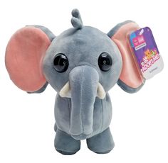 an elephant stuffed animal with big eyes and ears on it's head is shown in front of a white background