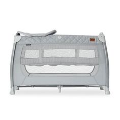 a baby crib that is grey and white