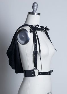 Mysterious, witchy harness belt made in thick, strong PVC or leather.  Channel your inner ghost or wraith and hide beneath a detachable hood in lightweight, soft gauze.  Hood attaches at the shoulders with long gauze fringe ties.  Tie them in bows or leave them loose (shown in pictures both ways).  Fit is adjustable with buckles and straps at waist, shoulders, and across chest.Silver-toned nickel plated steel hardware.   Shown in black PVC with black gauze cape and hood.  Also available in full Trap Clothes, Diy Crop Top, Harness Belt, Black Hood, Black Pvc, Body Harness, Fantasy Clothing, Post Apocalyptic, Detachable Hood